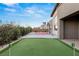 Spacious backyard featuring a putting green and basketball court at 6056 Willow Rock St, Las Vegas, NV 89135