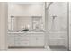 Bathroom with double vanity and glass shower at 6056 Willow Rock St, Las Vegas, NV 89135