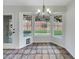 Bright dining area with bay window and tile flooring at 6108 Autumn Rose Way, Las Vegas, NV 89142