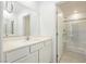 Bathroom with vanity, quartz countertop and shower at 675 Omaggio Pl, Henderson, NV 89011