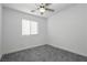 Spacious bedroom with gray carpet and ceiling fan at 675 Omaggio Pl, Henderson, NV 89011