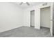 Bedroom with grey carpet, ceiling fan and sliding door closet at 675 Omaggio Pl, Henderson, NV 89011