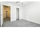 Bedroom with gray carpet, sliding door closet, and access to hallway at 675 Omaggio Pl, Henderson, NV 89011