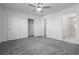 Bedroom with ceiling fan, carpet, and sliding door closet at 675 Omaggio Pl, Henderson, NV 89011