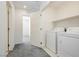 Laundry room with washer, dryer, and built-in shelving at 675 Omaggio Pl, Henderson, NV 89011