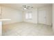 Bright and airy living room with tile floors and ceiling fan at 675 Omaggio Pl, Henderson, NV 89011
