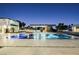 Luxury pool and spa with water features at night at 7815 W La Madre Way, Las Vegas, NV 89149