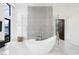 Luxury bathroom featuring a modern free-standing tub and glass shower at 7815 W La Madre Way, Las Vegas, NV 89149