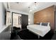 Modern bedroom with a copper wall and comfortable seating area at 7815 W La Madre Way, Las Vegas, NV 89149