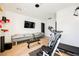 Modern home gym with a treadmill and tanning beds at 7815 W La Madre Way, Las Vegas, NV 89149