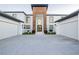 Modern home with two-car garage and desert landscaping at 7815 W La Madre Way, Las Vegas, NV 89149