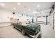 Spacious garage with car lift and ample storage at 7815 W La Madre Way, Las Vegas, NV 89149
