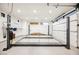 Modern garage featuring a car lift and storage at 7815 W La Madre Way, Las Vegas, NV 89149