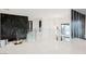 Bright hallway with glass railings and modern chandelier at 7815 W La Madre Way, Las Vegas, NV 89149