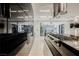 Sleek kitchen featuring stainless steel appliances and custom cabinetry at 7815 W La Madre Way, Las Vegas, NV 89149