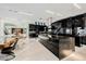 Modern kitchen with dark cabinetry, marble countertops, and a wine cellar at 7815 W La Madre Way, Las Vegas, NV 89149