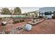 Landscaped backyard with desert plants and sculptures at 7815 W La Madre Way, Las Vegas, NV 89149