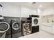 Modern laundry room with large capacity washer and dryer at 7815 W La Madre Way, Las Vegas, NV 89149