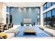 Spacious living area with floor-to-ceiling windows and a modern design at 7815 W La Madre Way, Las Vegas, NV 89149