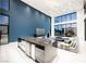 Open living space with large windows, comfortable seating, and a modern aesthetic at 7815 W La Madre Way, Las Vegas, NV 89149