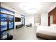 Large main bedroom with a king-size bed, a TV, and access to a private patio and bathroom at 7815 W La Madre Way, Las Vegas, NV 89149