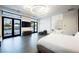 Main bedroom with king-size bed, large TV, and access to a luxurious en-suite bathroom at 7815 W La Madre Way, Las Vegas, NV 89149