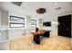 Modern home office with built-in shelving and a stunning live-edge desk at 7815 W La Madre Way, Las Vegas, NV 89149