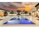 Luxury pool with fountains and outdoor lounge area at 7815 W La Madre Way, Las Vegas, NV 89149