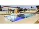 Luxury pool with outdoor kitchen and lounge area at 7815 W La Madre Way, Las Vegas, NV 89149