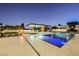 Expansive pool and patio with fire pit and bar at 7815 W La Madre Way, Las Vegas, NV 89149
