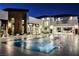 Luxury pool with patio, lounge chairs and modern lighting at 7815 W La Madre Way, Las Vegas, NV 89149