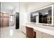Modern vanity with illuminated mirror in walk-in closet at 7815 W La Madre Way, Las Vegas, NV 89149