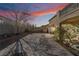 Private backyard featuring a paver patio, mature landscaping, and perimeter walls at 9236 Arbor Glen St, Las Vegas, NV 89123
