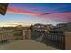 Balcony with metal railings and a view of the neighborhood at sunset at 9236 Arbor Glen St, Las Vegas, NV 89123