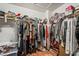Walk-in closet with a variety of clothing and shoe storage options at 9236 Arbor Glen St, Las Vegas, NV 89123