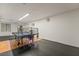 Game room with a ping pong table and mixed flooring of hardwood and rubber at 9236 Arbor Glen St, Las Vegas, NV 89123