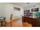 Home office with hardwood floors, desk, and built-in shelves at 9236 Arbor Glen St, Las Vegas, NV 89123