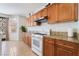 Bright kitchen showcasing granite counters, wooden cabinets, and stainless steel appliances at 9236 Arbor Glen St, Las Vegas, NV 89123