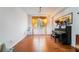 Spacious living room featuring wood floors, large windows, piano and nice decor at 9236 Arbor Glen St, Las Vegas, NV 89123