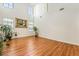 High ceiling living room with hardwood floors and large windows at 9236 Arbor Glen St, Las Vegas, NV 89123