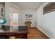 Cozy office space with wood floors, desk, and a map decoration on the wall at 9236 Arbor Glen St, Las Vegas, NV 89123