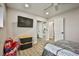 Second bedroom with mirrored closet and ceiling fan at 9340 W Washburn Rd, Las Vegas, NV 89149