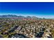 Aerial view of a large residential neighborhood with mountain views at 10332 Splendor Ridge Ave, Las Vegas, NV 89135