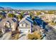 Two-story house with gray roof, mountain views at 10332 Splendor Ridge Ave, Las Vegas, NV 89135