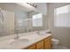 Bright bathroom with double sinks, and a shower at 10332 Splendor Ridge Ave, Las Vegas, NV 89135