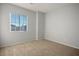 Well-lit bedroom featuring neutral walls and carpet at 10332 Splendor Ridge Ave, Las Vegas, NV 89135