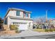 Two-story house with attached garage and landscaped front yard at 10332 Splendor Ridge Ave, Las Vegas, NV 89135