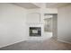 Living room fireplace with tile surround at 10332 Splendor Ridge Ave, Las Vegas, NV 89135