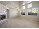 Bright living room with high ceilings and large windows at 10332 Splendor Ridge Ave, Las Vegas, NV 89135