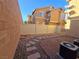 Small backyard with gravel landscaping and a block wall at 11998 Camden Brook St, Las Vegas, NV 89183